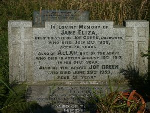 A pale grey marble, rectangular grave stone with lettering in black lead letters.
