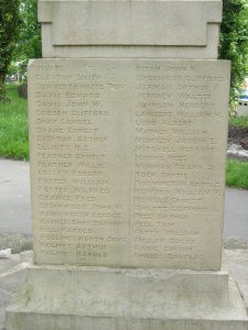 A sandstone panel on a war memorial, inscribed with the names of local men who had died in the Great War